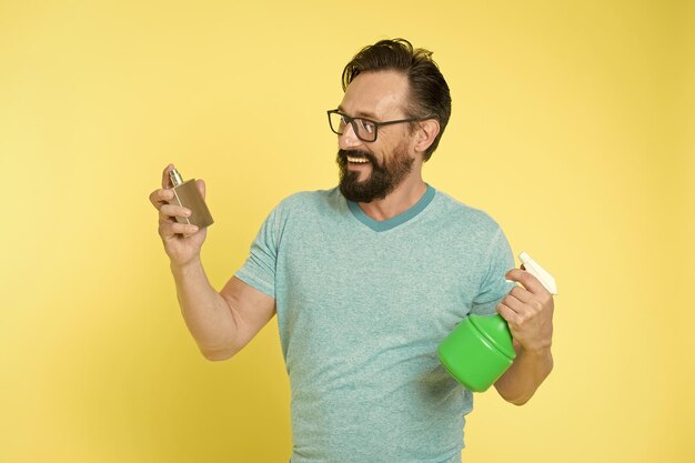 A skeptical person looking at a smartphone displaying exaggerated claims about the health benefits of lemon water.