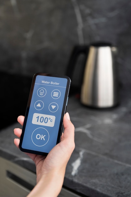 A close-up of a smart home hub controlling various appliances and lighting through a mobile app, highlighting the ease of remote control.