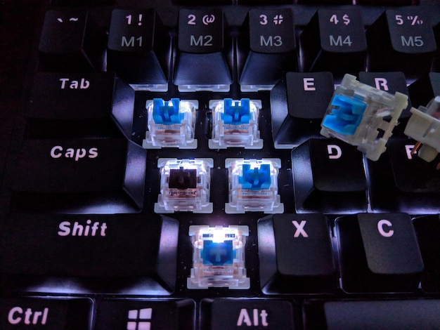 A vibrant, customizable mechanical keyboard with RGB lighting, showcasing different keycap sets and a focus on the tactile feedback of the switches.