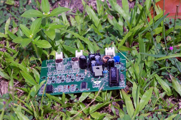 A close-up shot of an Arduino board connected to various sensors and components (soil moisture sensor, water pump, relay module) on a breadboard, with wires neatly arranged.
